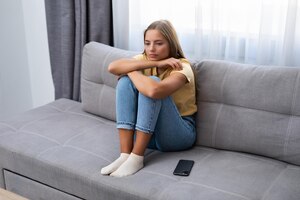 Sad depressed thoughtful young woman feeling bad at home