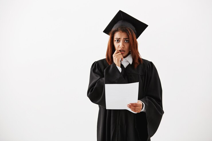 Free Photo sad displeased african female graduate holding test.