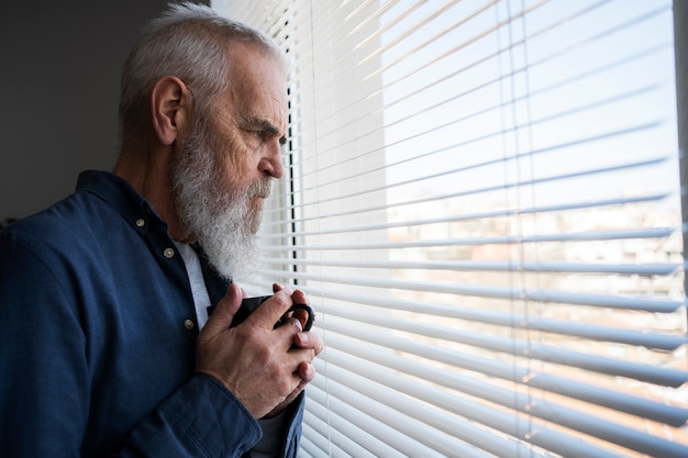 Sad elder man at home