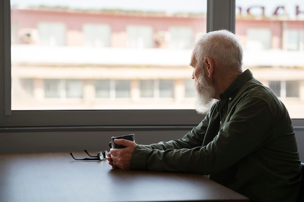 Sad elder man at home