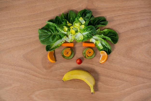 Free photo sad face made of fruits and vegetables