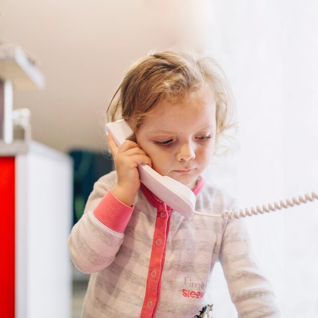 Sad girl speaking on phone