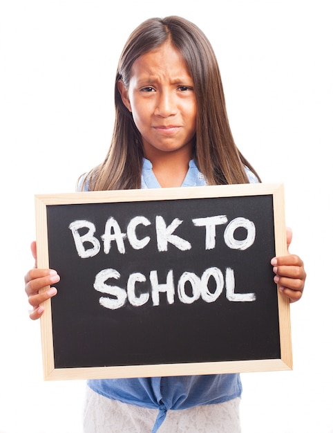 Sad girl with chalkboard