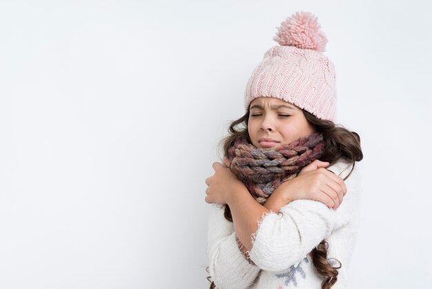 Sad girl with crossed hands on chest