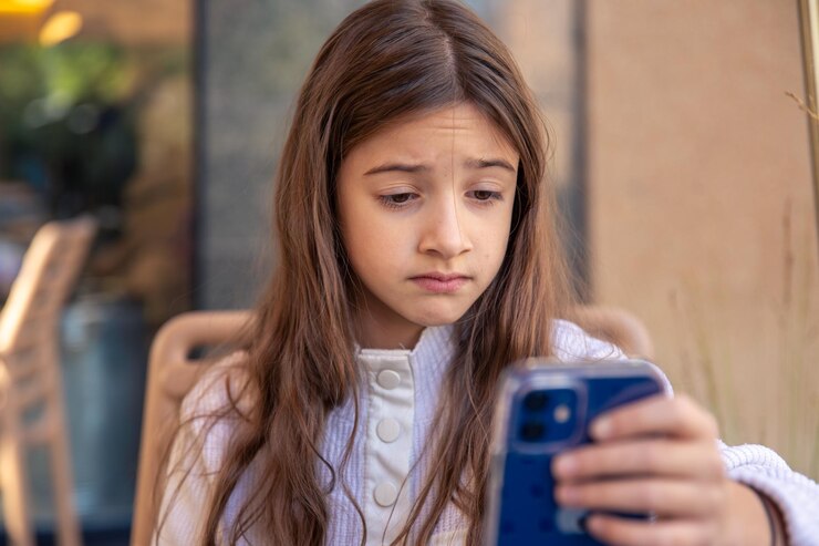 Free Photo sad girl with a phone sad girl using mobile phone