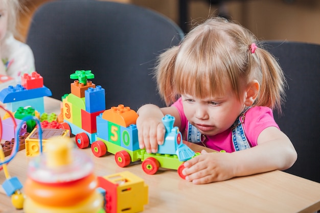 Sad girl with toy