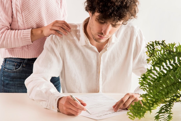 Sad man reading divorce decree