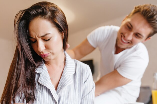 Sad woman doesn't want to look at her husband