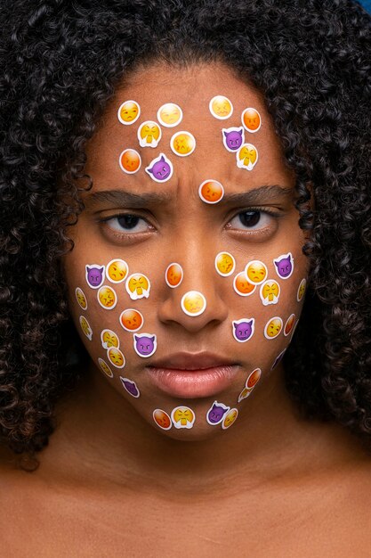 Sad woman with emojis on face