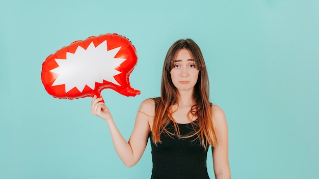 Free photo sad woman with speech bubble