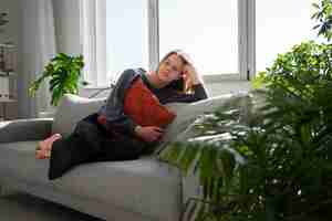 Free photo sad young woman at home