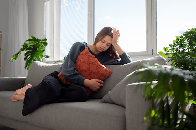 Sad young woman at home