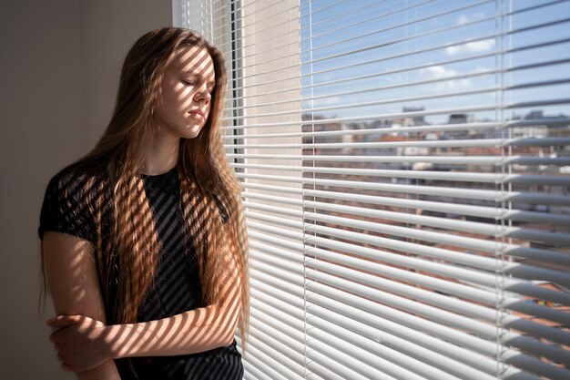 Sad young woman at home