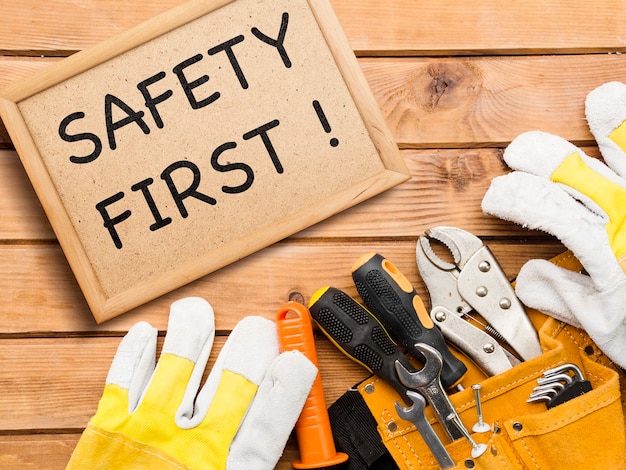 Free photo safety first sign and tools arrangement