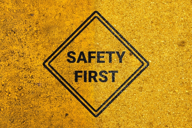 Safety first sign with golden background