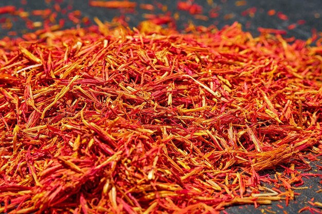 Saffron threads on dark background close up selective focus Aromatic spices and seasonings