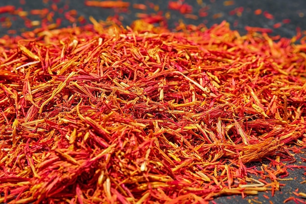 Saffron threads on dark background close up selective focus Aromatic spices and seasonings