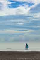 Free photo sailing boat on the beach