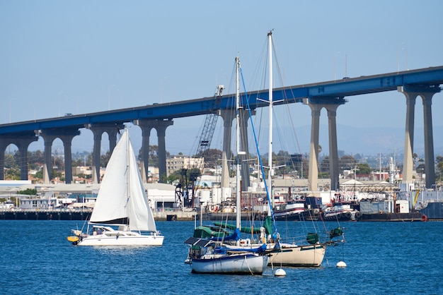 Sailing boats in waterfront area. Bridge  of San Diego