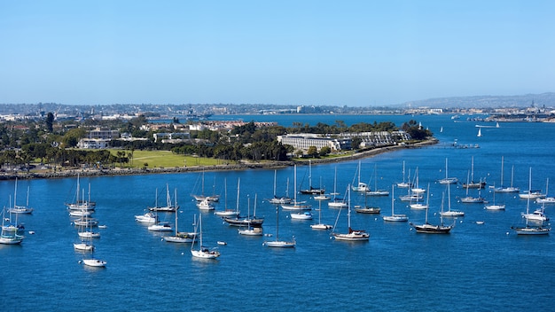 Sailing boats in waterfront area. San Diego cityscape 