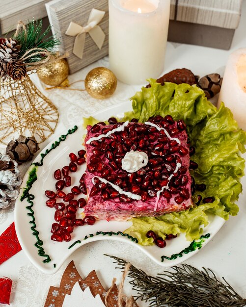 Salad covered with pomegranate