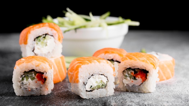 Salad and fresh sushi rolls