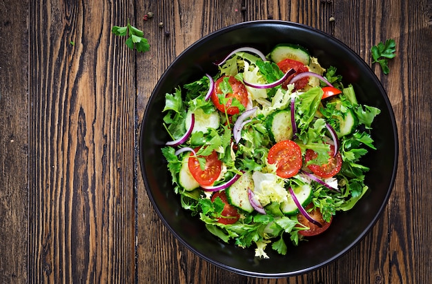 Free Photo | Salad from tomatoes, cucumber, red onions and lettuce ...