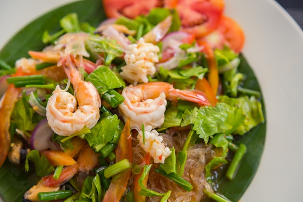 Salad on a plate with prawns
