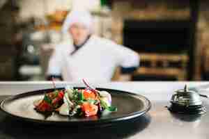 Free photo salad on plate with service bell