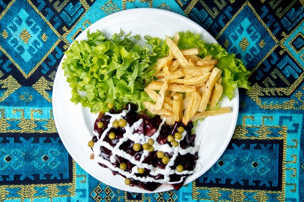 salad served with lettuce and french fries