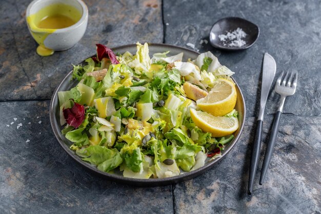 Salad with chicken chunks served on plate Closeup