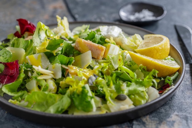 Salad with chicken chunks served on plate Closeup