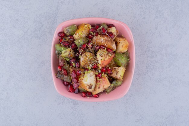 Salad with chopped fruits, herbs and spices