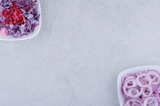 Salad with chopped and minced purple onion and cabbage