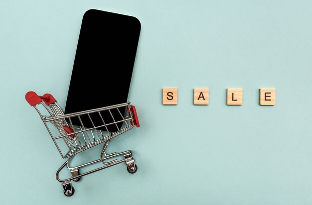 Sale of the phone at a discount. in a supermarket cart. trade in the store.