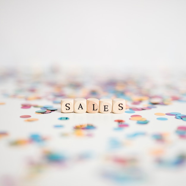 Sales inscription on small cubes with confetti 