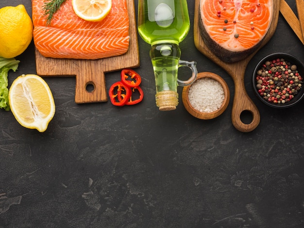 Free photo salmon and lemon arrangement above view