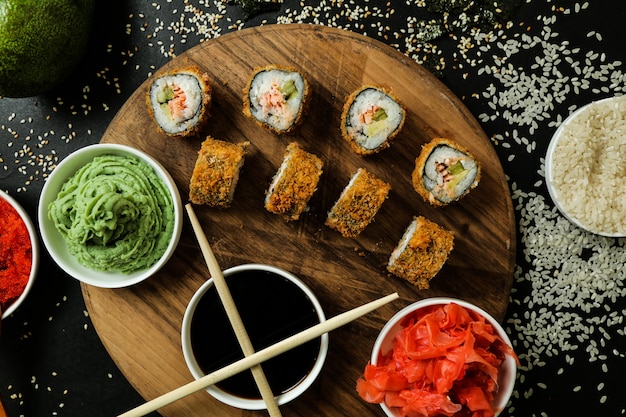salmon roll with rice, soy sauce, sesame, ginger and wasabi