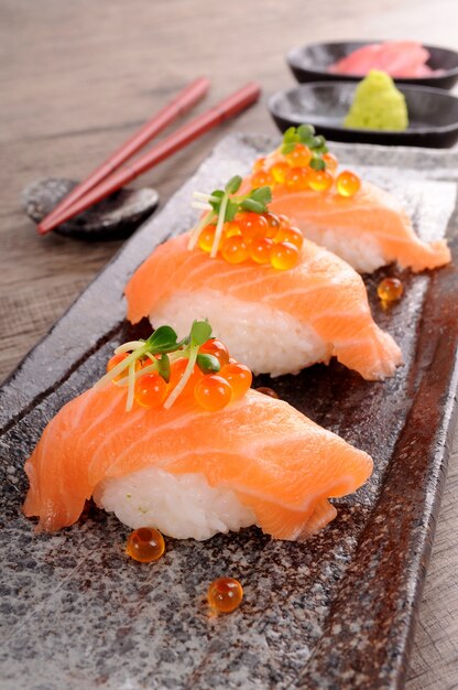 Salmon sushi with caviar in a row