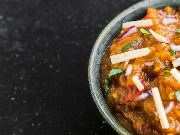 Salsa topped with cheese and cilantro