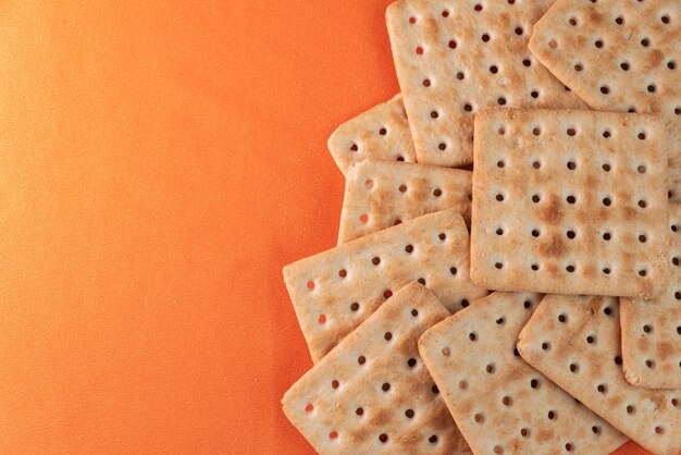 Salt crackers on the orange background