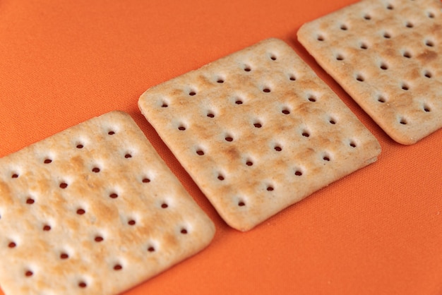 Free photo salt crackers on the orange table