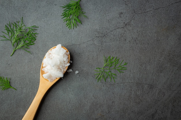 Salt in wooden spoon place on floor