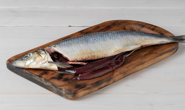 Salted herring on a cutting board