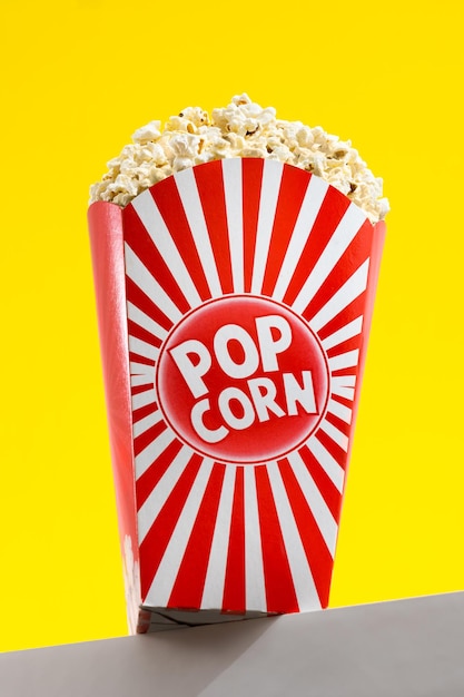 Salted popcorn on yellow background