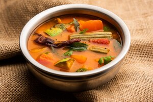 sambar is a lentil-based vegetable stew/soup, cooked with pigeon pea and tamarind broth. it is popular in south indian and sri lankan cuisines.