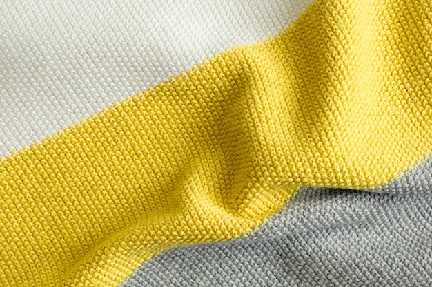 Sample of knitted fabric pattern trendy colors of the year 2021 illuminating, ultimate gray and white color.