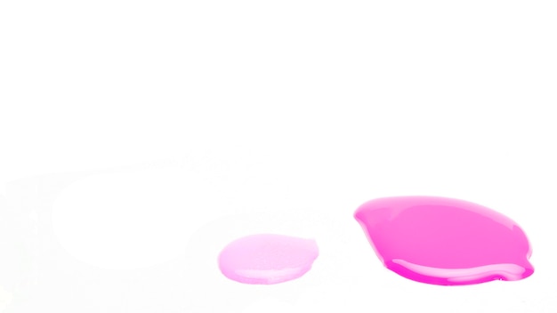 Sample of nail polish drop on white surface