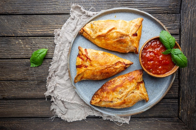 Samsa or samosas with chicken fillet