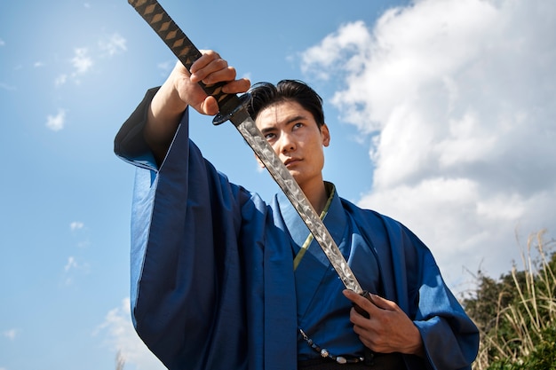 Samurai with sword outdoors